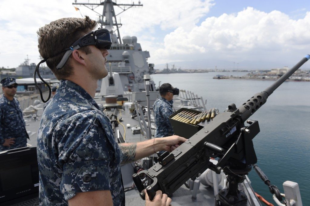 U.S. Navy Enlists Virtual and Augmented Reality for Cutting-Edge Training and Recruitment U.S. Navy using VR and AR - Sailor defending against virtual enemy combatants during a virtual reality training program demonstration.