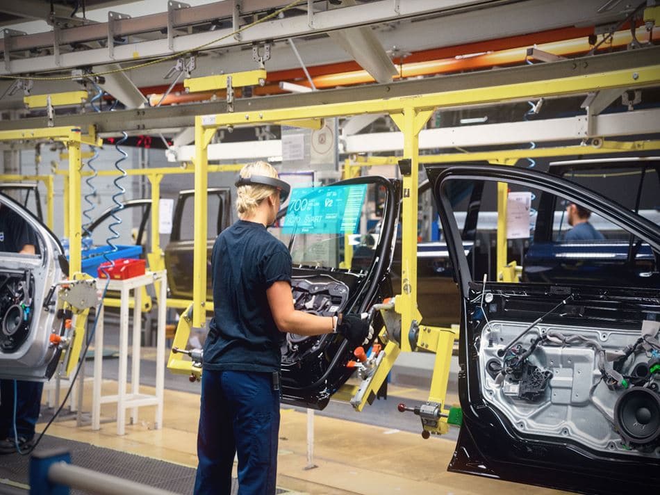 Ways in Which AR/VR Technology Is Transforming the Manufacturing Industry AR/VR technology in manufacturing - hololens volvo - woman using AR in manufacturing