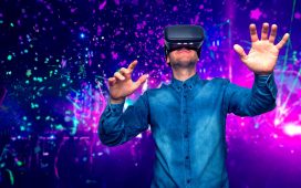 Man wearing virtual reality goggles. Concert background