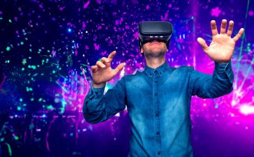 Man wearing virtual reality goggles. Concert background