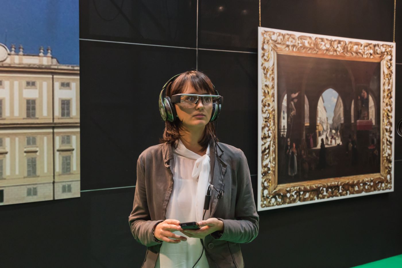 woman wearing AR glasses at an international exhibition