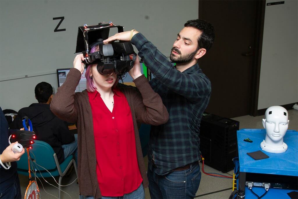Associate professor Gabriel Diaz, right, received a grant from the National Institutes of Health to use virtual reality to help patients with cortically-induced blindness restore portions of their vision.