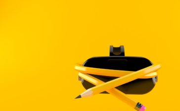 XR Education in 2021 - VR headset with pencil isolated on orange background