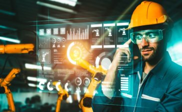 Augmented reality for workplace productivity - man using augmented reality glasses in manufacturing