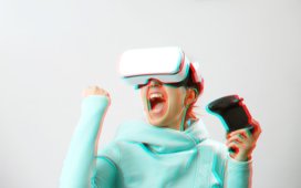 Woman playing a VR game - Women as Guides for Empathetic Design in Virtual Reality